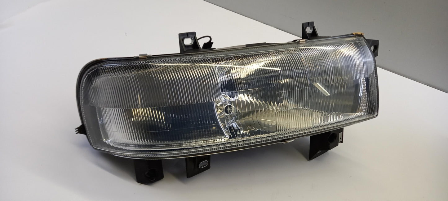 Original OE NISSAN Scheinwerfer 7701044520